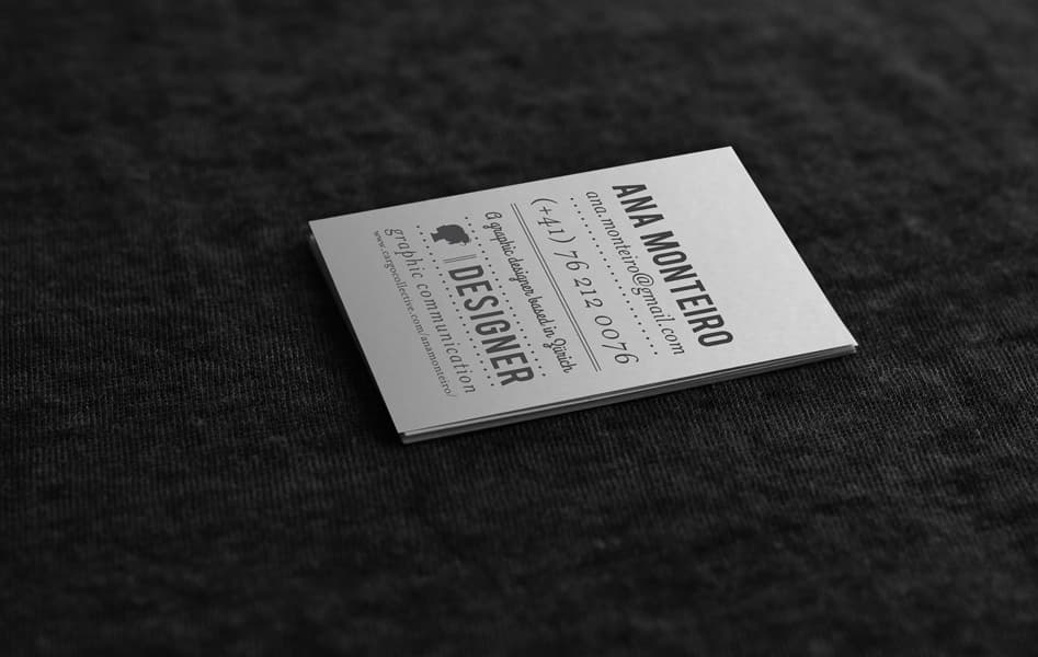 Ana Monteiro’s own business card on dark fabric, mixing bold condensed capitals, script and typewriter-style type with dotted rules and the word “Designer”