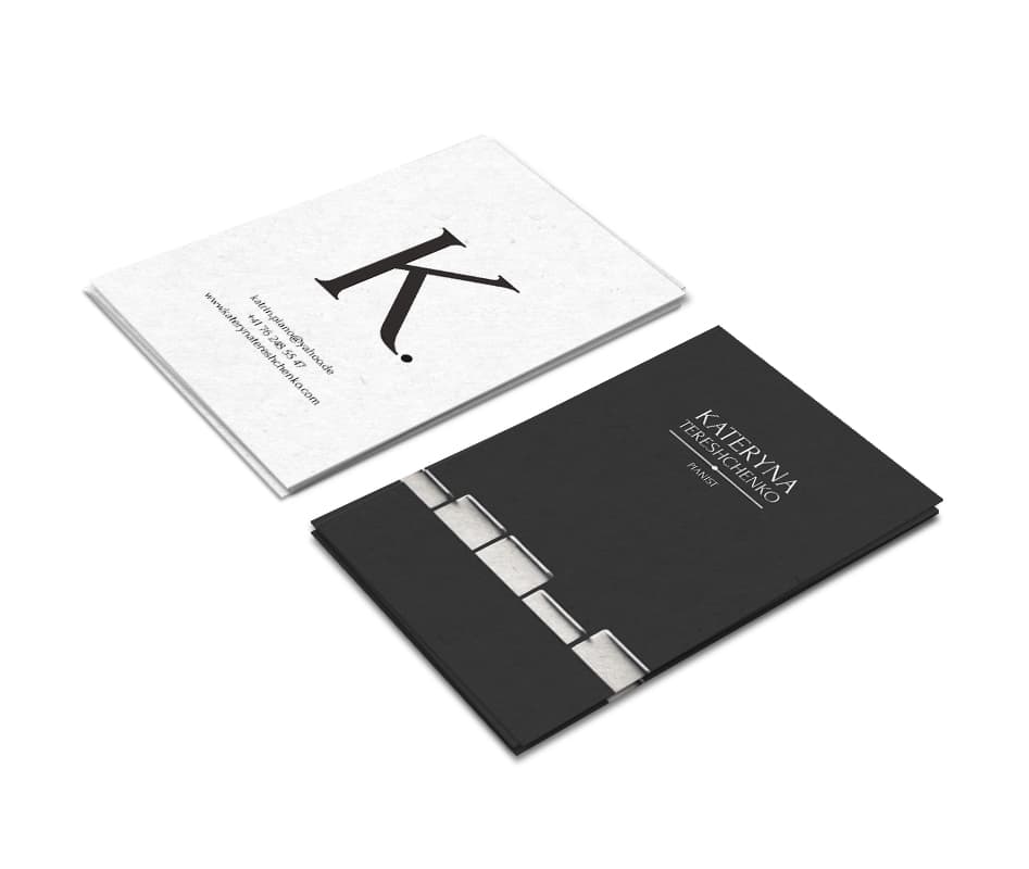 Business cards: a white card with a large serif “K.” and contact details, and a black card with “Kateryna Tereshchenko, Pianist” and a strip of white piano keys